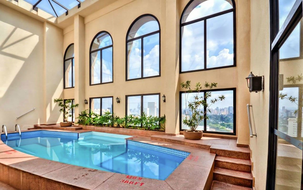 The hotel&rsquo;s indoor pool area with city view