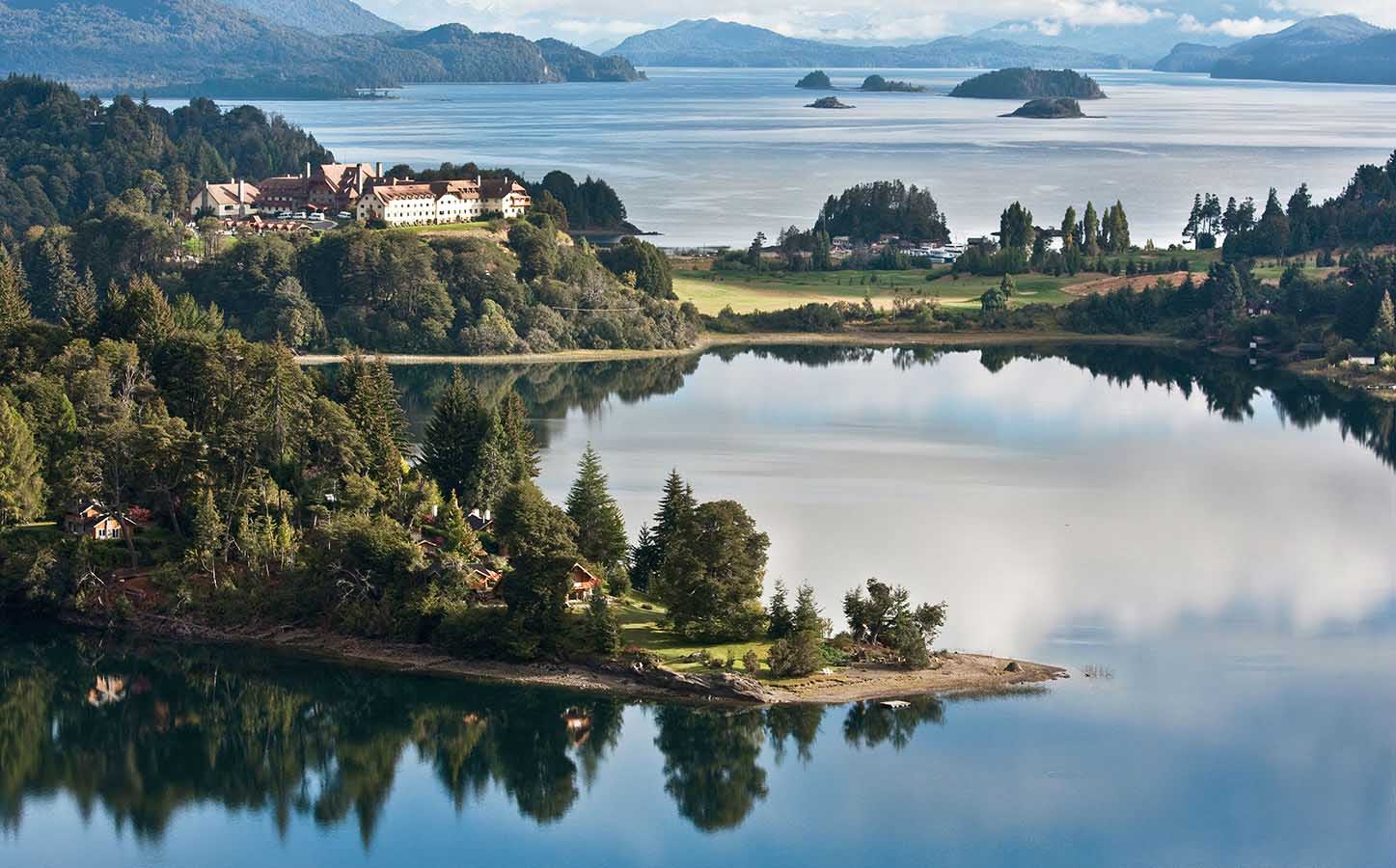 The glorious Llao Llao Peninsula, with cloud and tree reflecting on the crystalline waters
