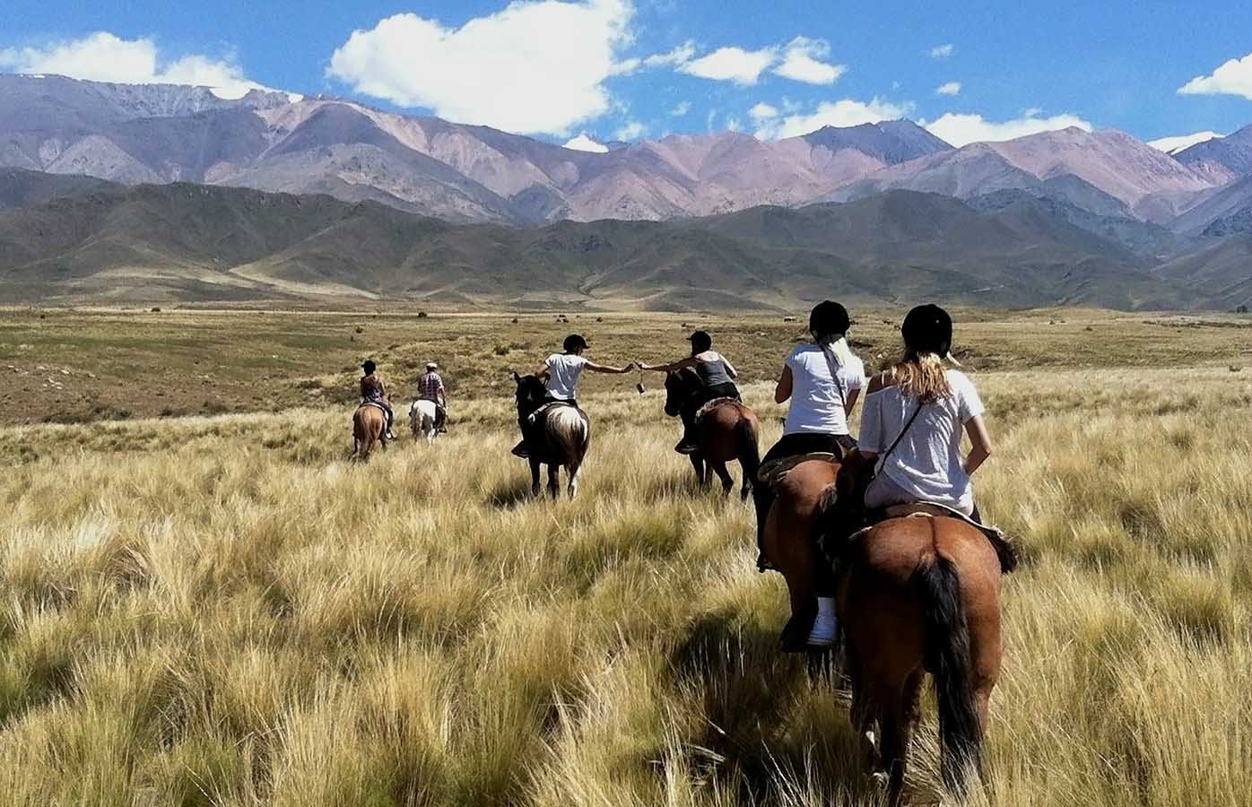 Saddle up and head out into the heights of the Mendoza hills on horseback!