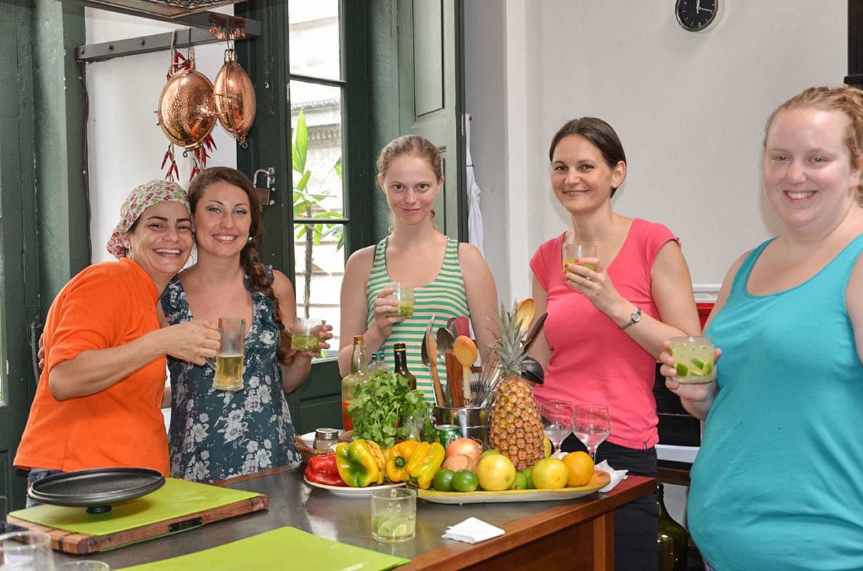 We&rsquo;ll warm up to our cooking experience while savoring "caipirinhas"!