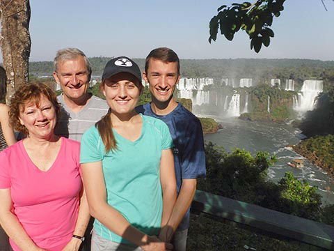 Ginger, Terry & kids with the mighty Iguazu Falls behind them