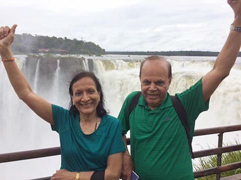 Varsha & Kirit enjoying the might and mist of the Iguazu Falls